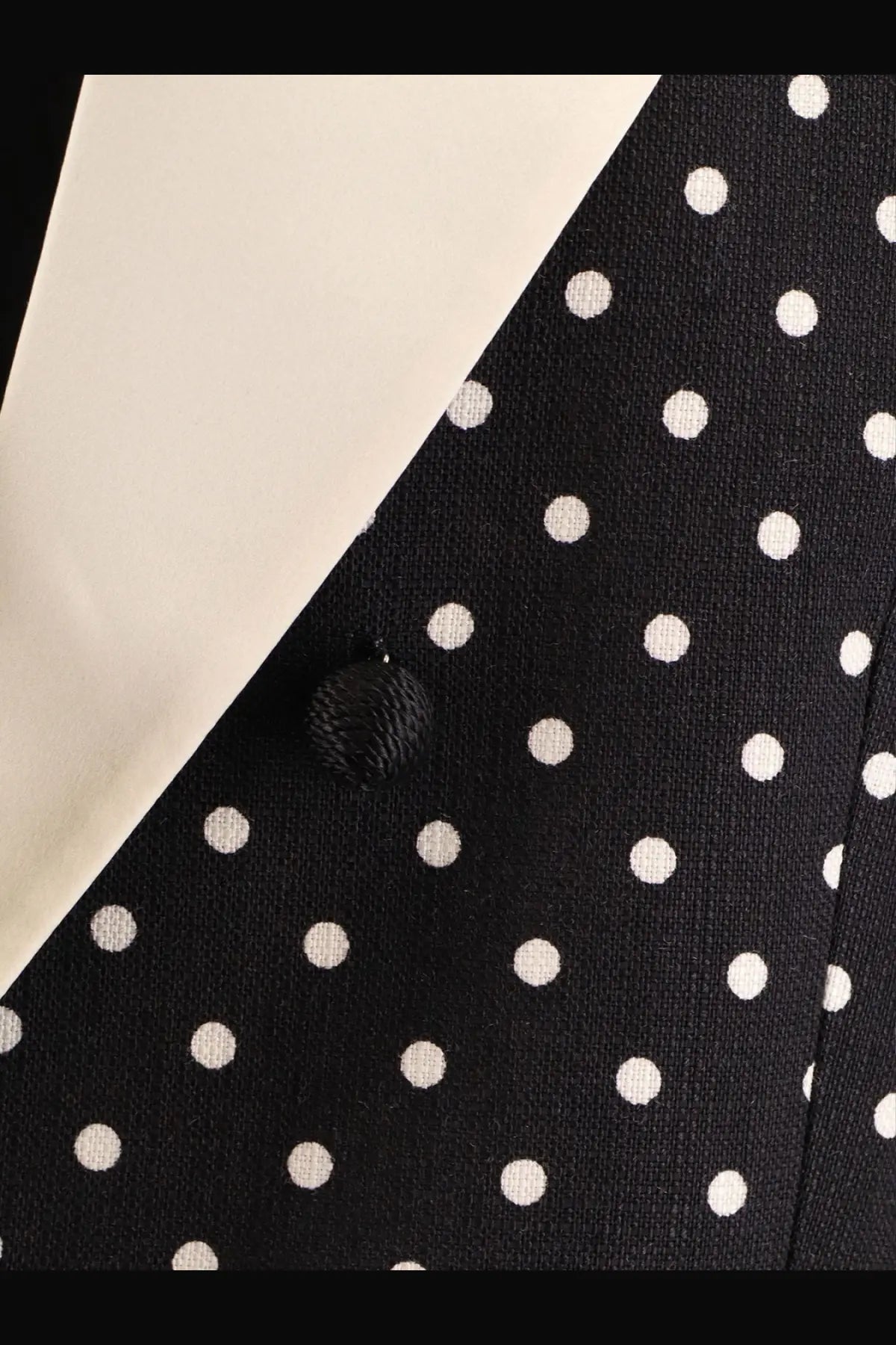 Valentino women’s black viscose blazer featuring white polka dots and a textured black button detail