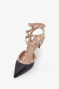 Valentino women’s black leather pointed-toe pump with gold-tone pyramid studs and t-strap slingback design