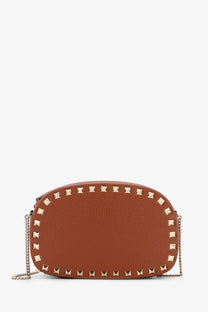 Valentino women’s rockstud tan leather crossbody bag with gold-tone square studs and chain strap
