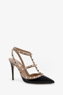 Valentino women’s black patent leather pointed-toe stiletto pumps with tan suede straps and gold pyramid studs