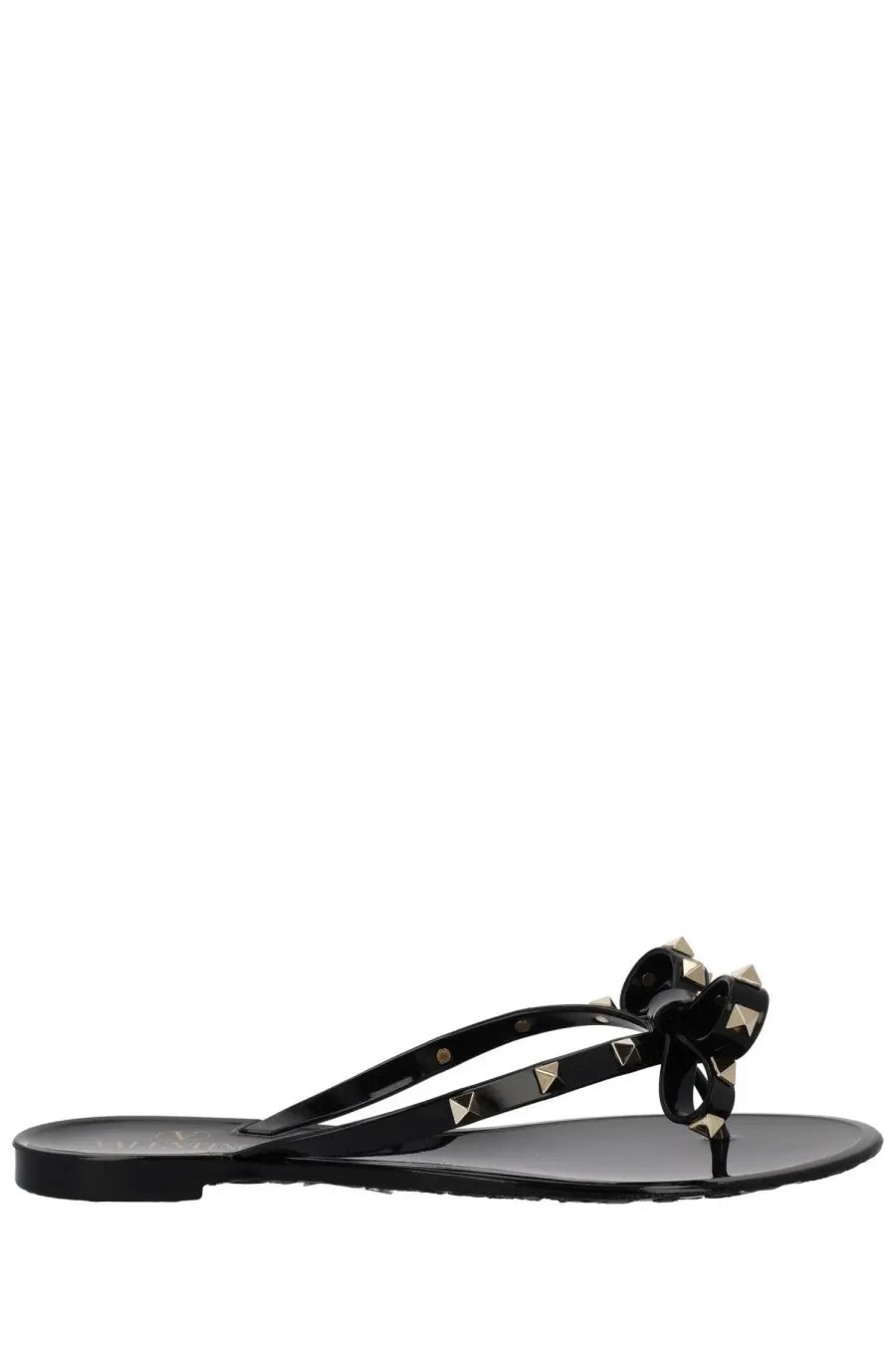 Valentino women’s black glossy flip-flop sandal with a bow adorned by gold-tone triangular studs