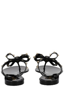 Valentino women’s rockstud black rubber flip-flops with silver-tone pyramid studs on bow-adorned straps