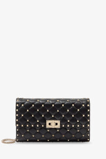 Valentino women’s black quilted leather crossbody bag with gold-tone rockstud spike studs and metallic clasp
