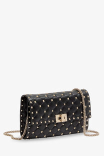 Black quilted leather Valentino womens crossbody bag with gold-tone studs and chain strap for stylish use