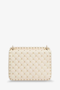 Valentino women’s cream-colored quilted leather handbag with gold-tone studs and top handle white crossbody bag