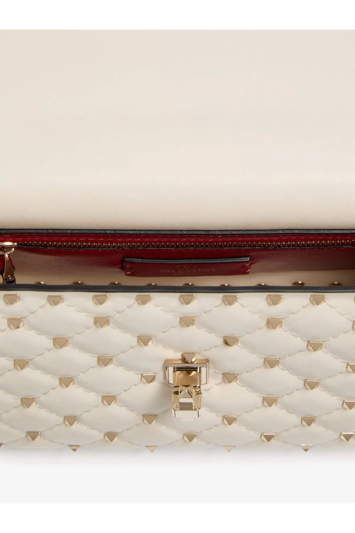 Valentino women’s white quilted leather crossbody bag with gold-tone studs and matching metallic clasp