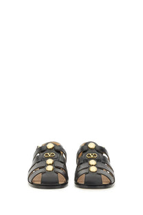 Black leather Valentino women’s sandal fisherman with gold-tone Vlogo hardware and circular stud detailing