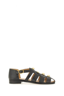 Valentino women’s black leather sandal with gold-tone circular studs and low block heel fisherman’s style