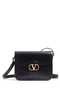 Valentino women’s black leather shoulder bag featuring rockstud gold-tone hardware crossbody style