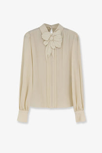 Valentino women’s beige silk blouse with prominent floral embellishment at the neckline