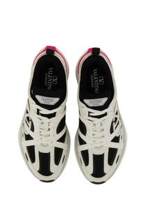 Valentino women’s sneaker Vlogo Easyjog white showing back view with white and black leather and pink heel tab accents