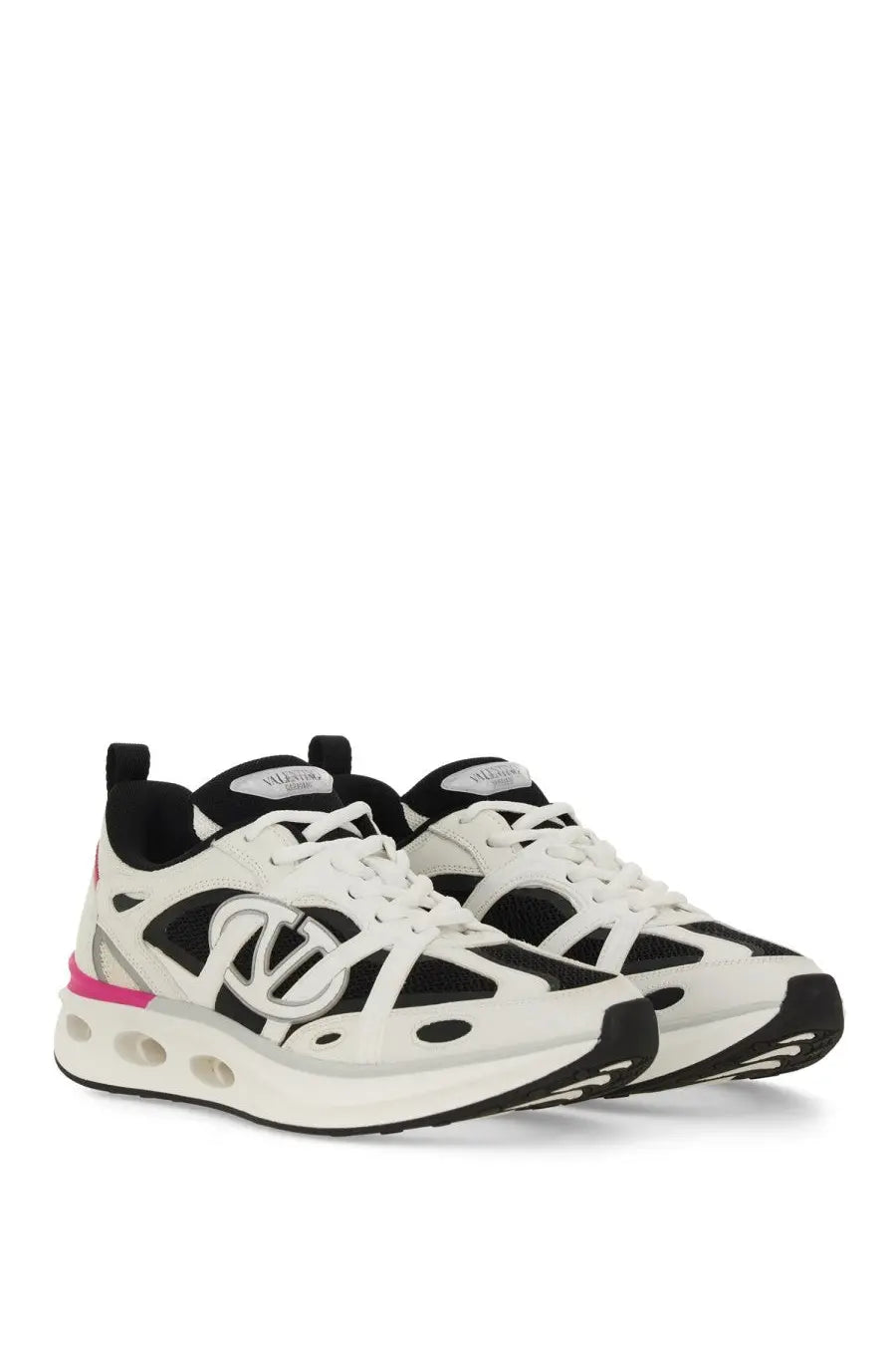 Valentino women’s sneaker vlogo easyjog white with bold black and white geometric design and vibrant pink heel detail back view