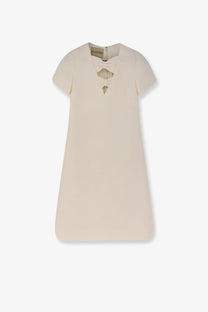 Valentino women’s cream-colored virgin wool and silk mini dress with short sleeves and bow detail at neckline