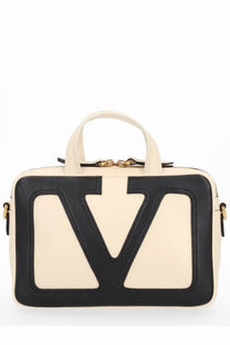 Cream-colored leather Valentino women’s Viva Superstar handbag with bold black v-shaped logo patch and gold-tone hardware