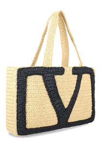 Beige woven straw Valentino women’s Viva Superstar large shopping bag with bold black embroidered v logo