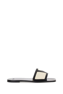 Valentino women’s viva superstar slide sandal in black and cream nappa leather with minimalist rectangular strap design