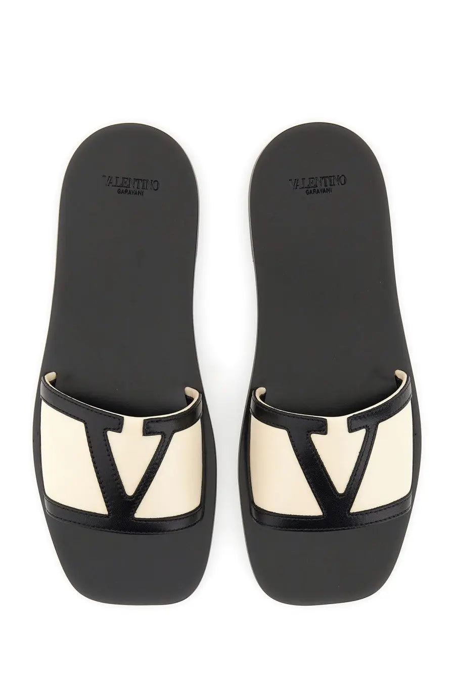 Valentino women’s Viva Superstar slide sandal in white nappa leather with black and cream slides and glossy black V logo