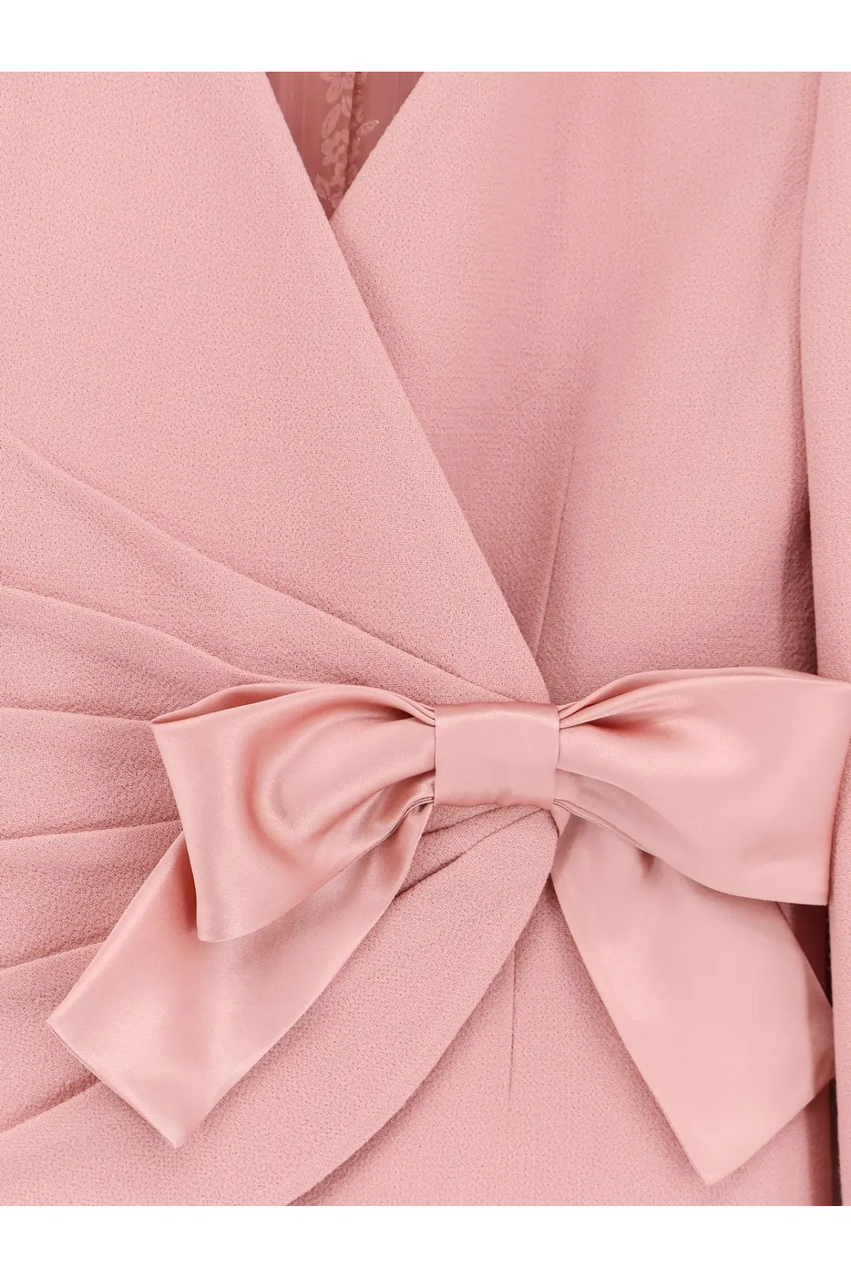 Valentino women’s wool crepe blazer pink with a soft pink satin bow tied at the waist of a matching coat