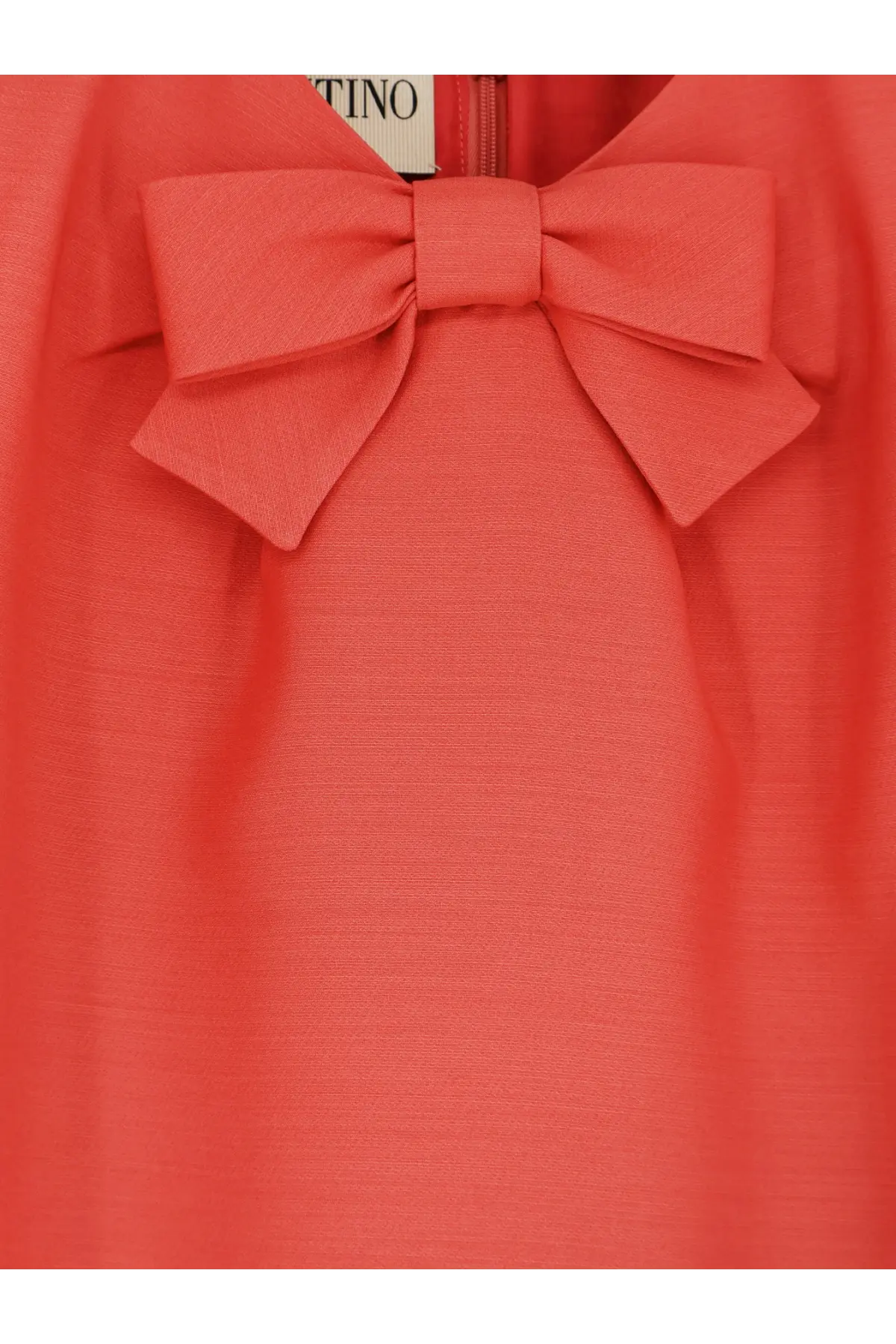 Valentino women’s wool and silk blend short dress in coral with a prominent bow at the neckline