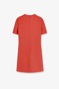Back view of valentino women’s coral wool and silk blend short dress with central zipper and minimalist design