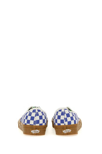 Vans men’s authentic sneaker white featuring blue and white checkerboard pattern with gum rubber soles