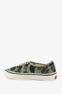 Vans men’s lx authentic canvas sneaker in olive green and black camouflage with white laces and cream rubber sole