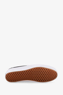 Vans men’s lx authentic reissue canvas slip-on sneakers in black and white with brown rubber soles and diamond tread pattern