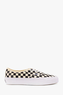 Vans men’s Lx Authentic Reissue sneakers in black with cream checkerboard pattern white laces and thick white sole