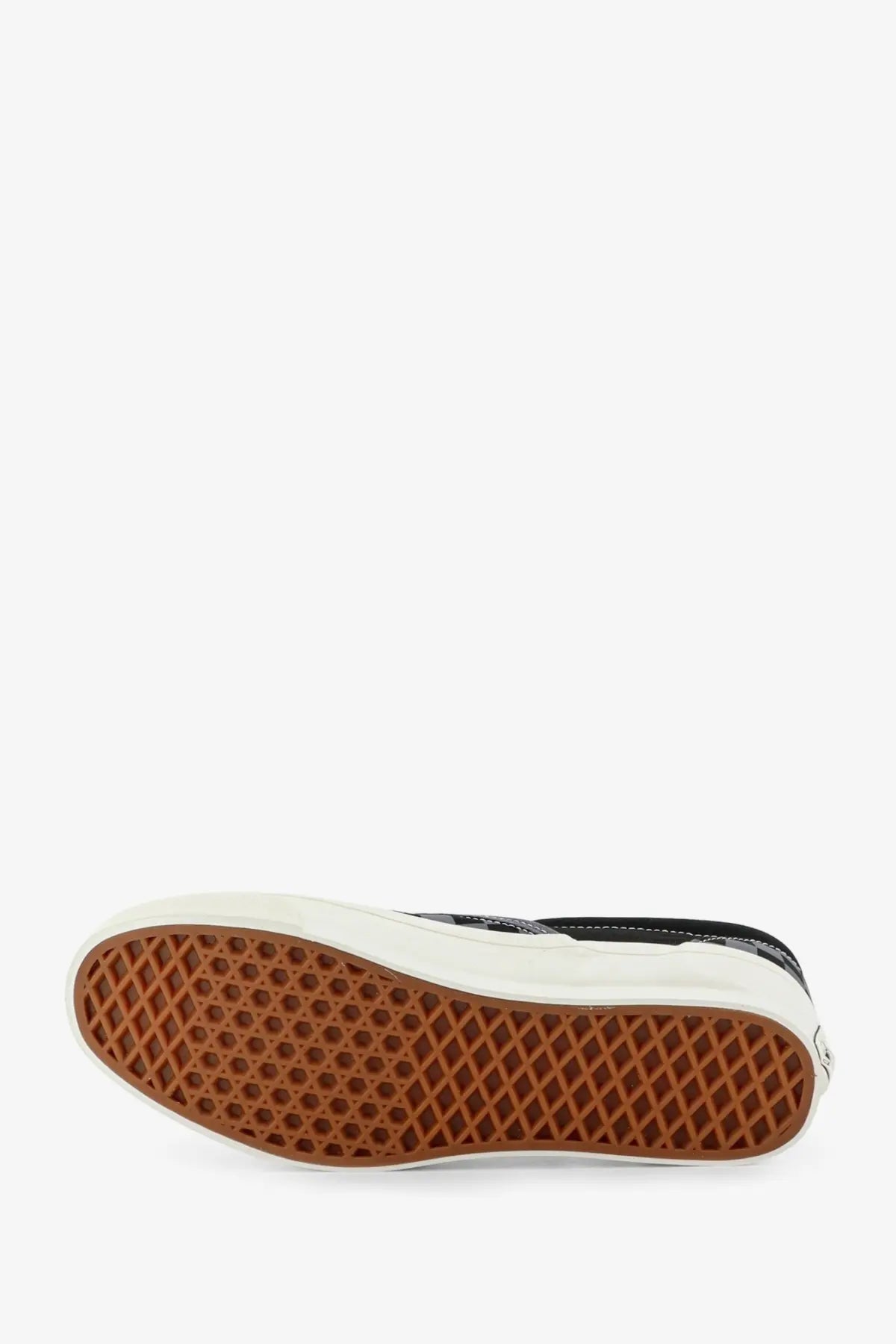 Black vans men’s lx classic slip on canvas sneaker in grey with white rubber sole and brown waffle-patterned outsole