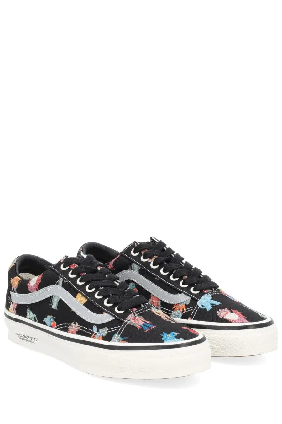 Vans men’s sneaker old skool in black with colorful cartoon dinosaur print silver side stripe and white rubber sole