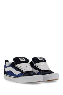 Navy and white Vans unisex knu skool sneaker with blue side paneling and durable canvas material for casual wear
