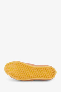 Orange rubber sole with a distinctive diamond-patterned tread on vans unisex lx authentic canvas sneakers red