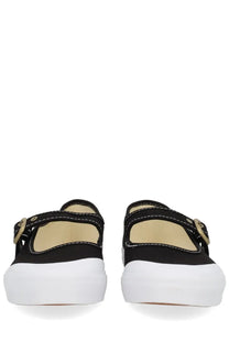 Vans unisex mary jane shoe in black canvas with white platform soles and gold-tone buckle details