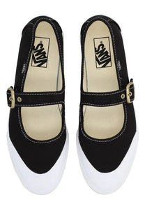 Vans unisex mary jane shoe in black canvas with white rubber soles and gold-tone buckle straps
