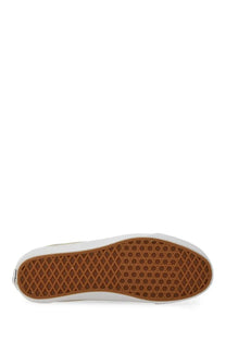 Beige vans unisex old skool xl slip-on shoe with brown rubber sole featuring classic diamond tread pattern