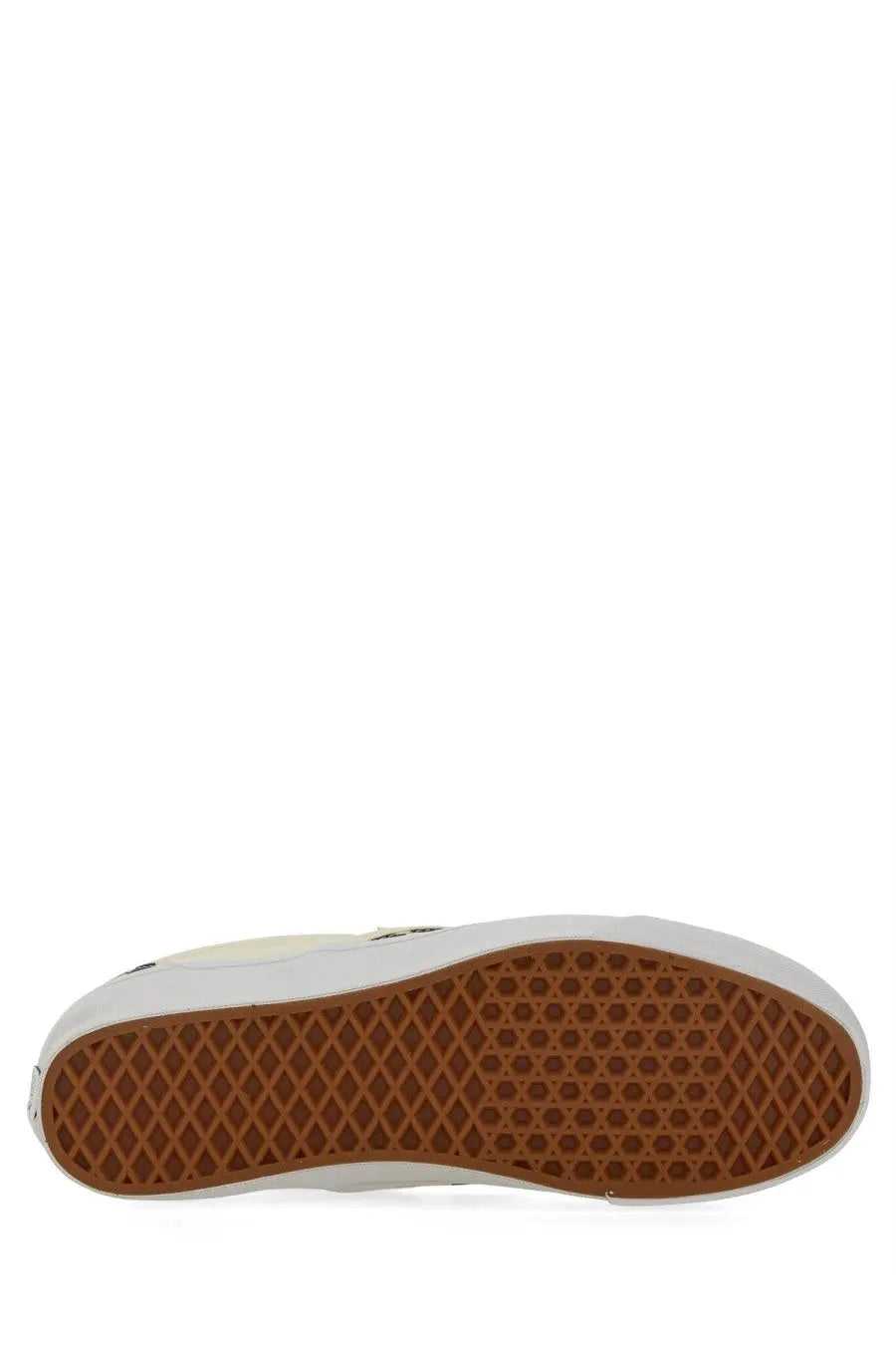 Vans unisex slip on premium white shoe with brown rubber sole featuring classic diamond tread pattern