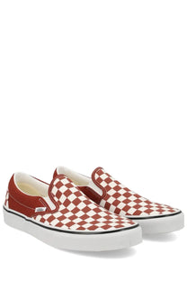 Vans unisex slip on sneakers featuring a red and white checkerboard pattern with canvas material and rubber soles