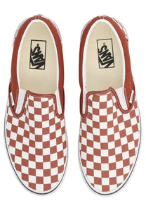 Vans unisex slip on sneaker in red and white checkerboard canvas upper with a slip on design