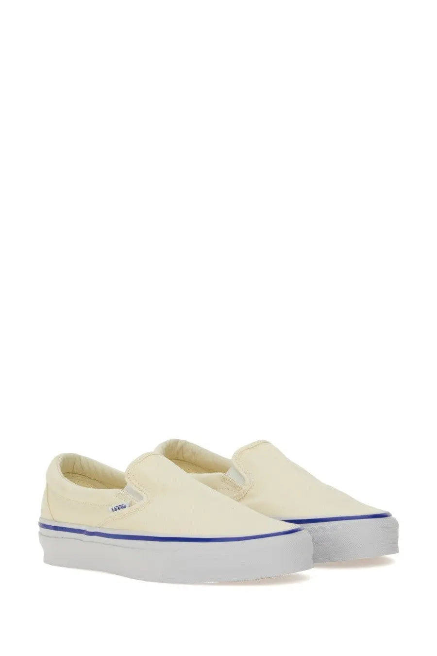 Vans unisex slip on reissue sneaker in cream canvas with white rubber sole and blue stripe featuring Vans logo on side