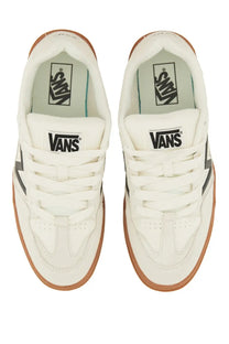 White vans unisex upland sneaker with black side stripes and tan rubber soles in a classic skate shoe design