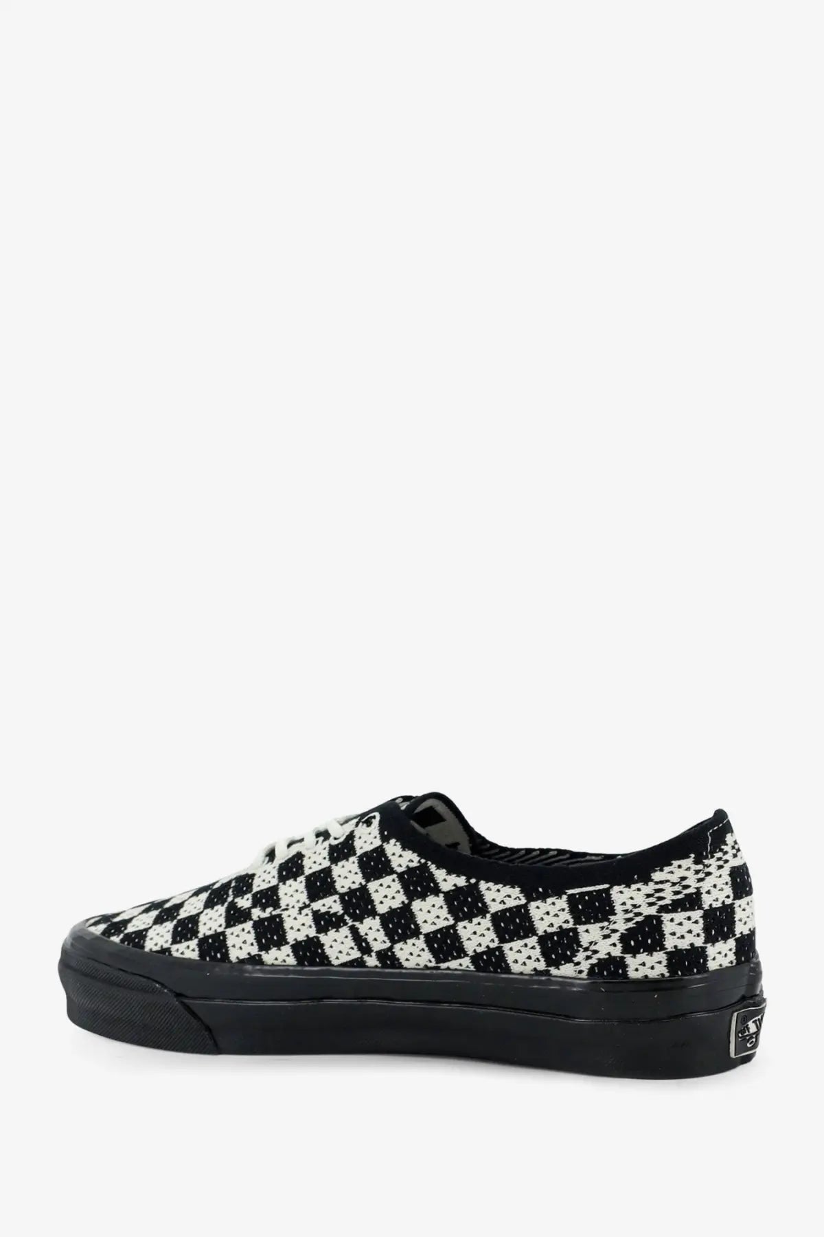 Vans women’s LX authentic fabric sneaker in black with black and white checkerboard textured fabric upper and rubber sole