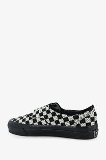 Vans women’s LX authentic fabric sneaker in black with black and white checkerboard textured fabric upper and rubber sole