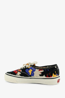 Vans women’s lx authentic sneakers black canvas low top with vibrant red blue yellow floral embroidery on cream background