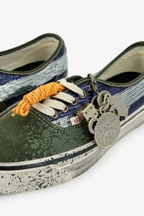 Olive green and navy blue speckled canvas vans women’s lx authentic suede sneakers with white laces and keychain charms