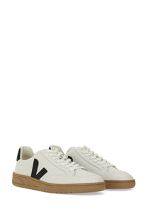 Veja men’s sneaker white leather with bold black v logo on the side and tan rubber soles