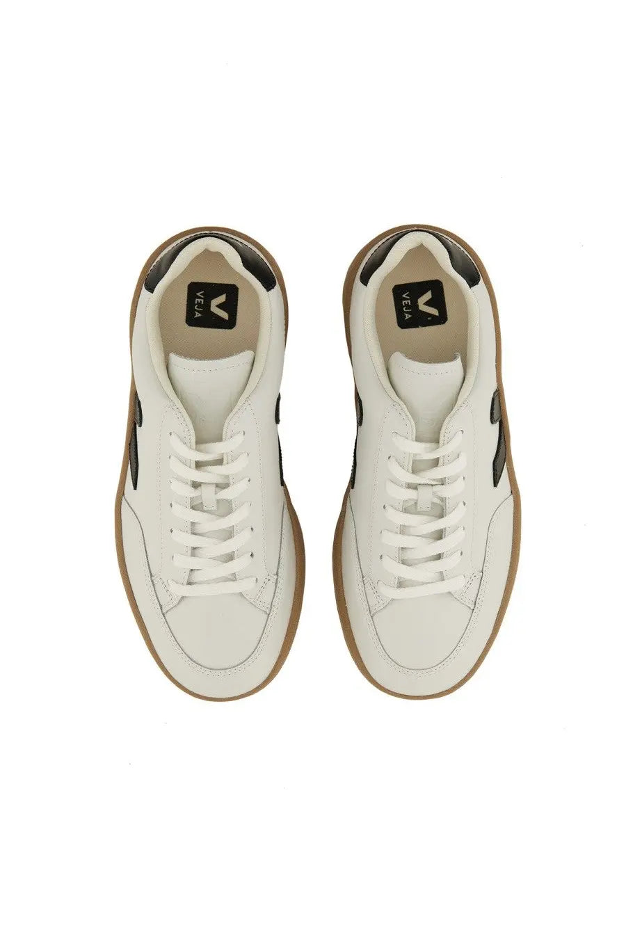Veja men’s sneaker white leather vela sneakers with black accents and tan rubber soles in front view