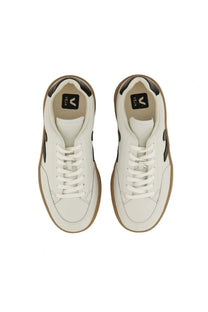 Veja men’s sneaker white leather vela sneakers with black accents and tan rubber soles in front view