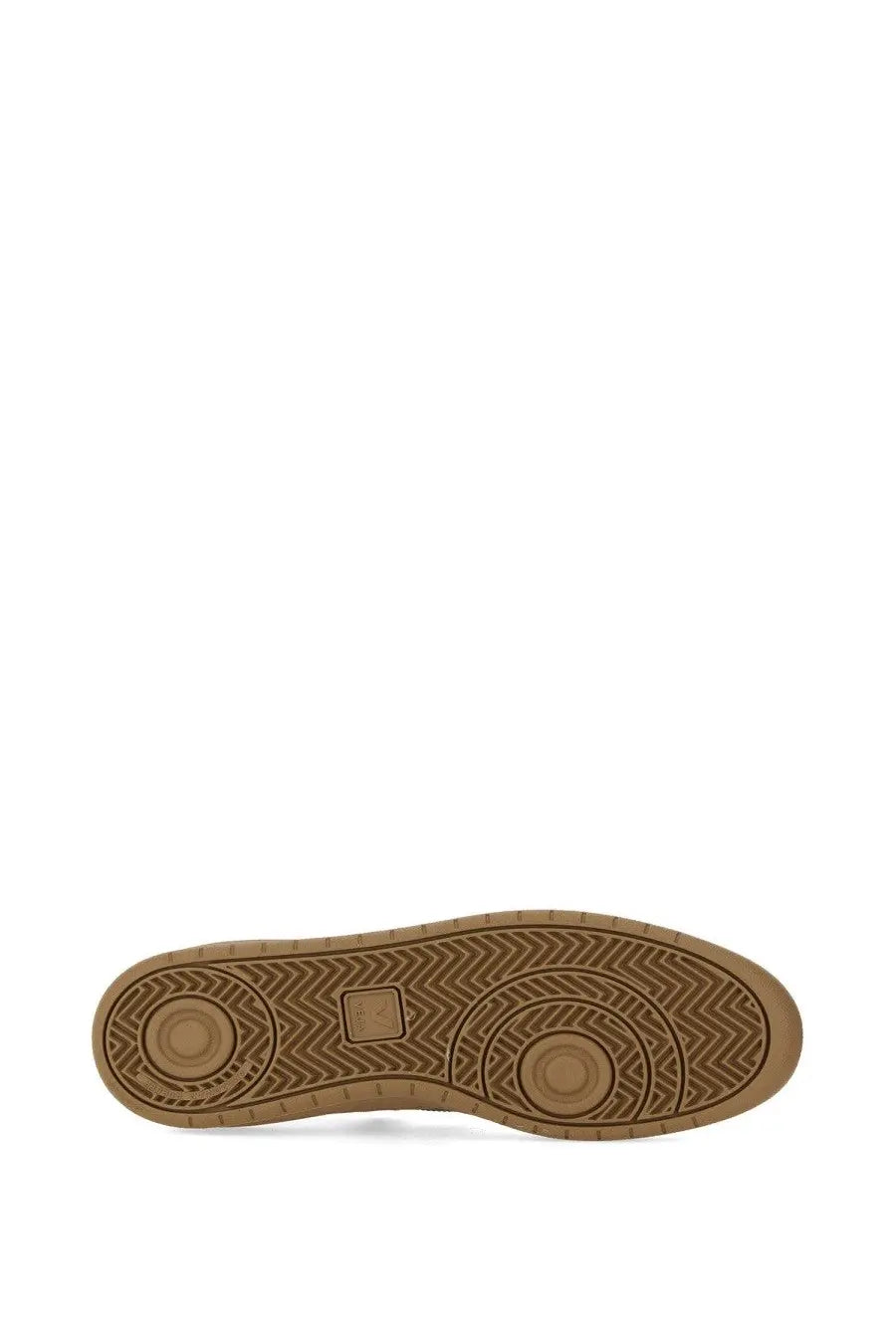 Tan rubber sole with herringbone tread and circular grip zones on veja men’s sneaker white