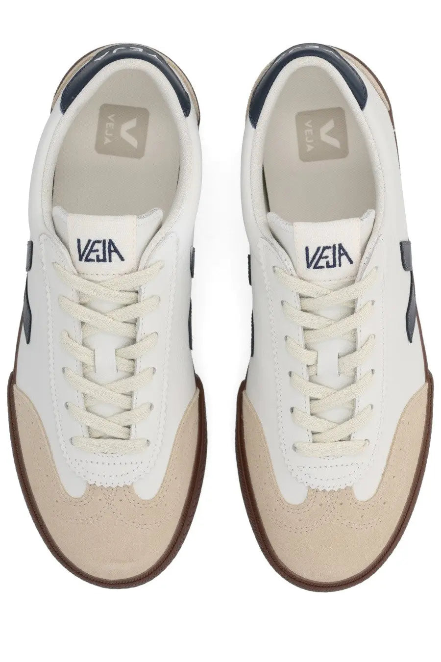 Veja men’s volley sneaker white in white and beige with navy blue accents showcasing its stylish design