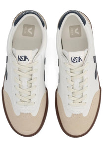 Veja men’s volley sneaker white in white and beige with navy blue accents showcasing its stylish design